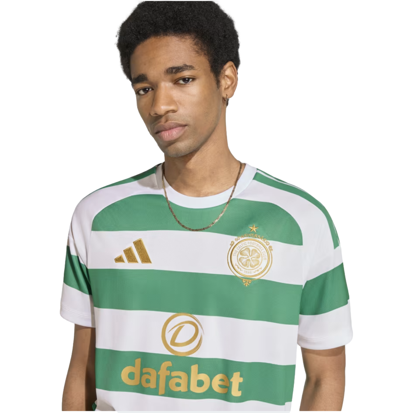 A young man wearing a green and white striped Celtic FC soccer jersey with gold Adidas and Dafabet logos, set against a plain white background.