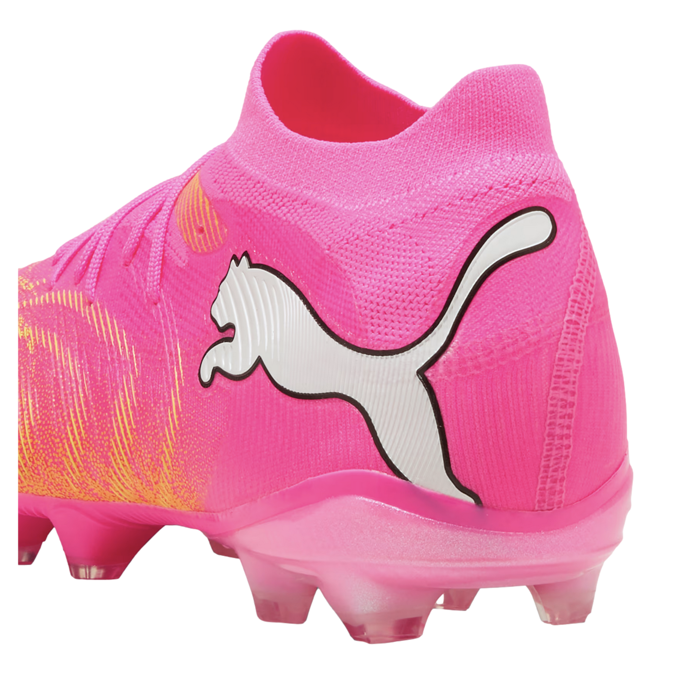 Bright pink Puma soccer cleat with a large white cat logo, pink knitted upper, and matching pink studded sole.